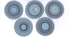 Spirella Scrapbook Embellishments with blue thread on blue paper Spirella Scrapbook Embellishments with blue thread on blue paper