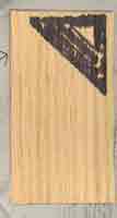 Embellishment for Scrapbook Layout of veeneer with a rubber stamp of a carpenters triangle